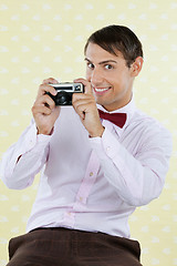 Image showing Male Geek Holding Retro Camera