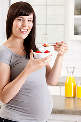 Image showing Happy Pregnant Woman Eating Breakfast