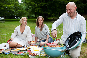 Image showing Friends with BBQ picnic in Park
