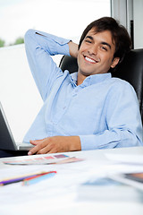 Image showing Relaxed Interior Designer With Laptop