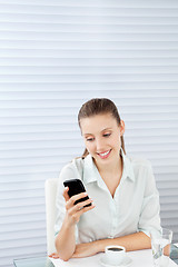 Image showing Young Businesswoman Reading Text Message