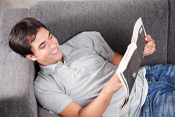 Image showing Young Man Reading newspaper