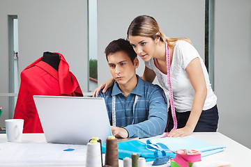 Image showing Clothing Designers Working On Laptop