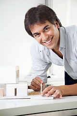 Image showing Architect Working On a Model House