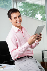 Image showing Business Executive Holding Digital Tablet