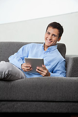 Image showing Happy Man Holding Digital Tablet