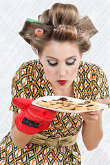 Image showing Woman Smelling Plate Of Cookies