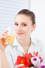 Image showing Young Woman Drinking Juice