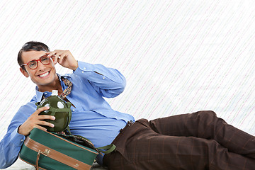 Image showing Businessman Lying With Travel Bag