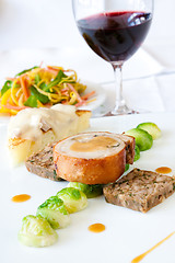 Image showing Suckling Pig Steak served with Wine