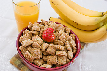 Image showing Wheat Squares, Orange Juice and Bananas for Breakfast