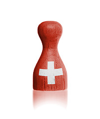 Image showing Wooden pawn with a painting of a flag