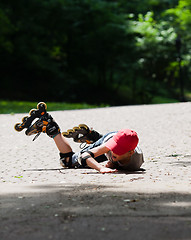 Image showing Little rollerblader takes a tumble