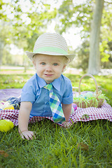 Image showing Cute Little Boy Smiles With Easter Eggs Around Him 
