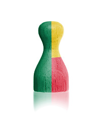 Image showing Wooden pawn with a painting of a flag