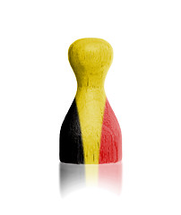 Image showing Wooden pawn with a painting of a flag