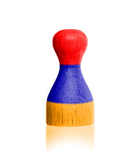 Image showing Wooden pawn with a painting of a flag