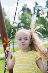 Image showing Swinging little girl