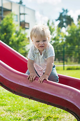 Image showing Baby boy on a slide