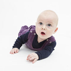 Image showing surprise toddler on floor