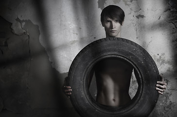 Image showing Man with tire