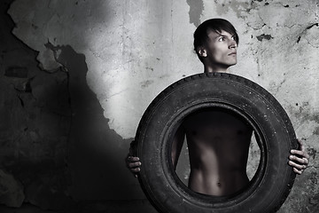 Image showing Man with tire