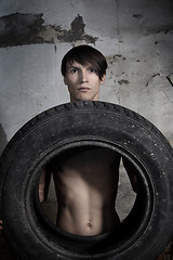 Image showing Man with tire