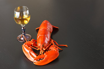 Image showing Boiled Atlantic Lobster with glass of white wine