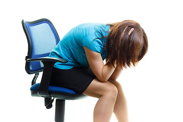 Image showing upset and tired girl on a chair on a white background