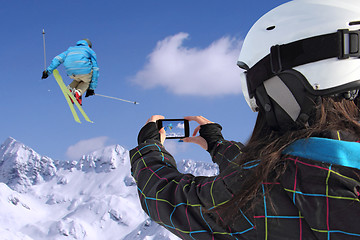 Image showing Mobile phone photographs of skiers jump