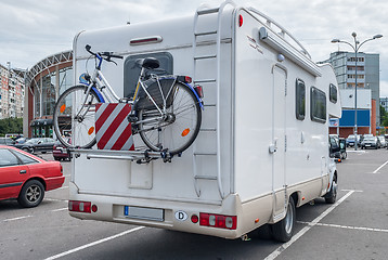 Image showing camper with bicycle in city