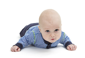 Image showing attentive baby laying on ground