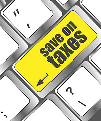 Image showing save on taxes word on laptop keyboard key, business concept