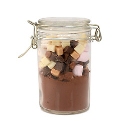 Image showing Ingredients for hot chocolate in a glass jar