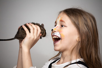 Image showing girl painted as a cat with grey mouse in hands