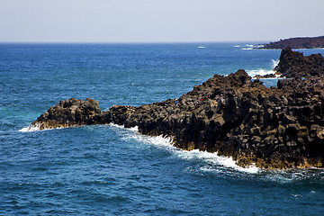 Image showing people   coastline stone volcanic    sky cloud beach  and summer