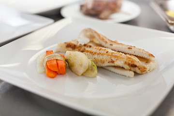 Image showing Fried fish fillets and vegetables