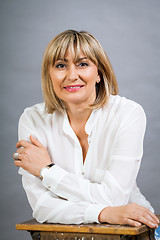 Image showing Smiling confident middle-aged blond woman