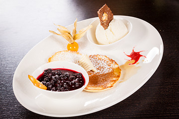 Image showing tasty sweet pancakes with vanilla icecream and topping