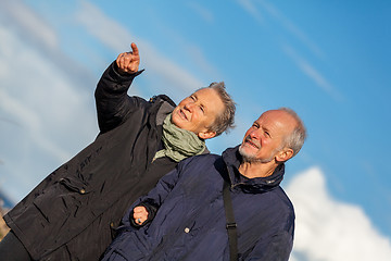 Image showing happy elderly senior couple walking on beach