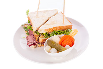 Image showing Delicious pastrami club sandwich and pickles