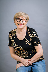 Image showing Attractive blond senior woman wearing glasses