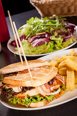 Image showing Club sandwich with potato French fries