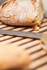 Image showing homemade fresh baked bread and knife 