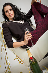 Image showing Seductive brunette holding a glass of champagne