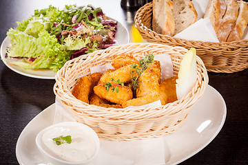 Image showing Crumbed chicken nuggets in a basket