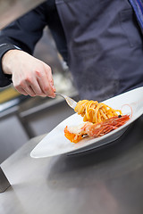 Image showing Chef plating up seafood pasta