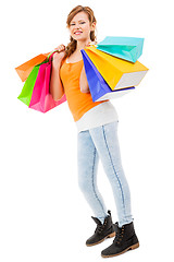 Image showing attractive young woman with colorful shopping bags