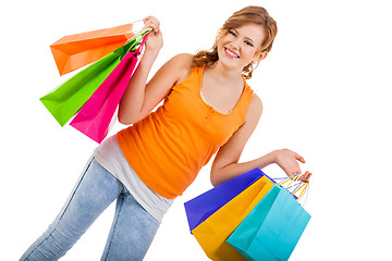 Image showing attractive young woman with colorful shopping bags