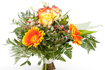 Image showing Vivid orange gerbera daisy in a bouquet